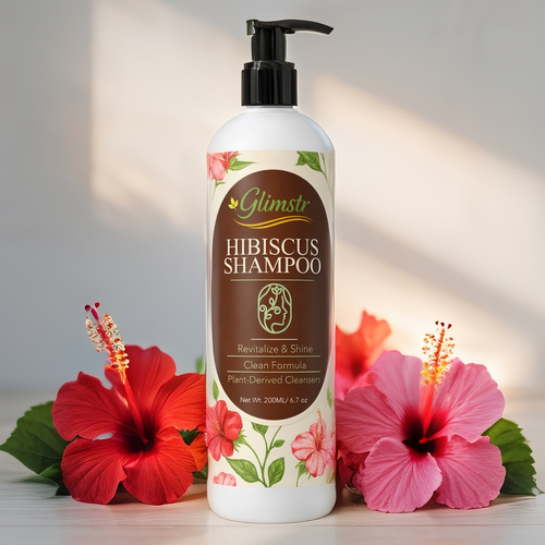 Glimste Hibiscus Shampoo bottle with flowers on a light background